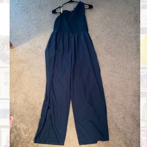 One shoulder jumpsuit in a deep green